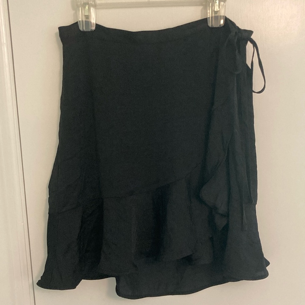 Black wrap skirt with ruffled hem